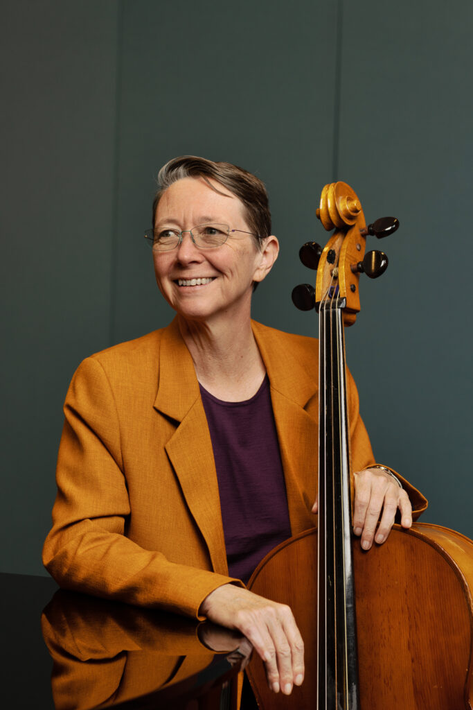 Female with glasses and cello